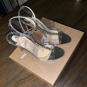 Clear Christian Louboutin heels.